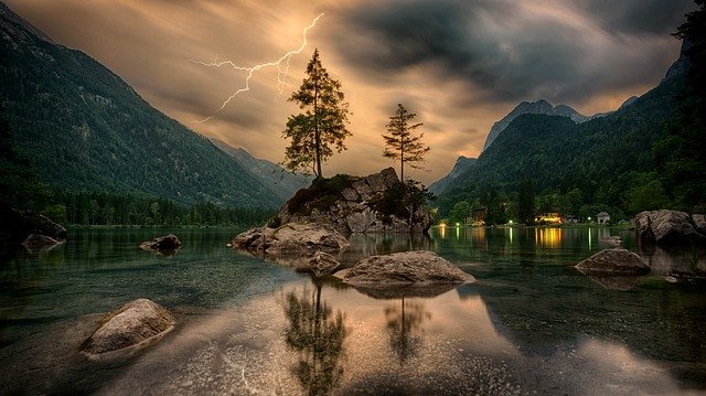 Lightning strikes on a mountain lake