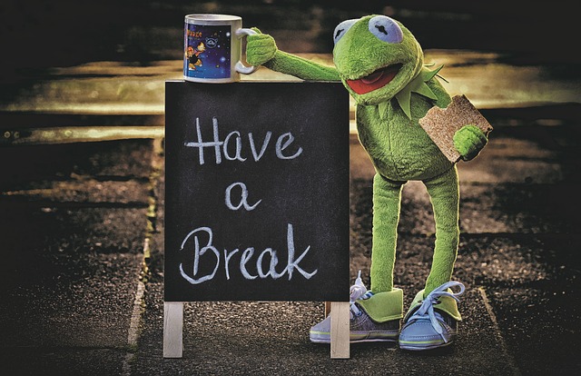 Kermit the frog with a mug and Have a Break sign