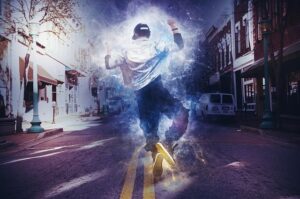 man in a baseball cap dancing down the street