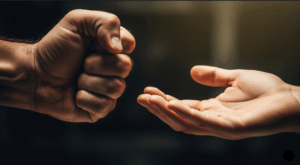 a clenched hand and an open hand