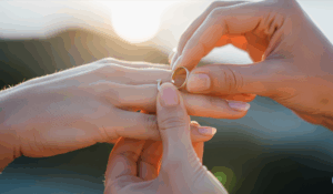 a woman breaking her wedding ring