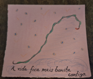 a drawing in a piece of pink paper