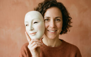 a lady removing the mask of happiness